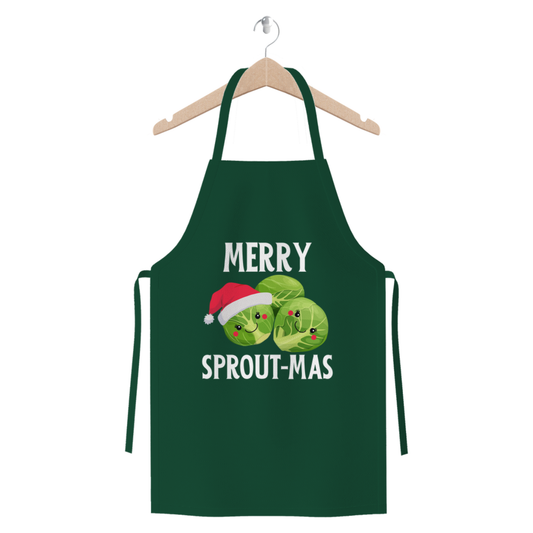 Dark green Christmas apron on a hanger with cute Brussels sprout characters and the slogan “Merry Sprout-mas” printed on the front.