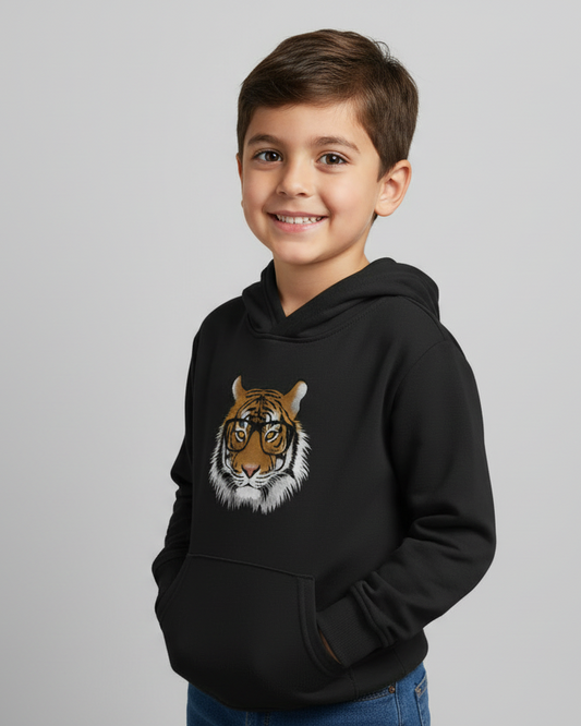 Child wearing kids black hoodie with tiger face design, side angle view.