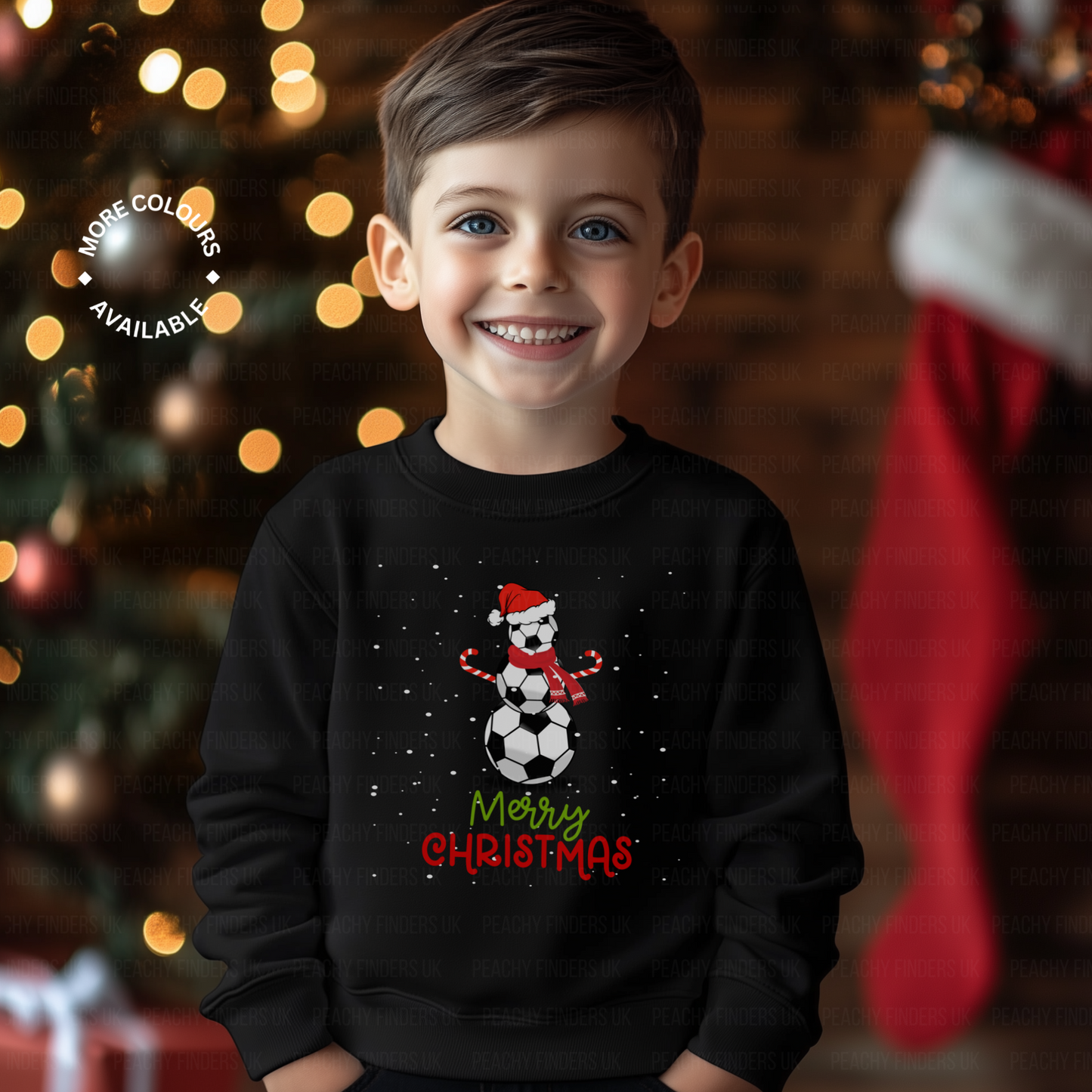 Child wearing a black Christmas sweater with a football snowman design and 'Merry Christmas' text, standing in front of a decorated Christmas tree.