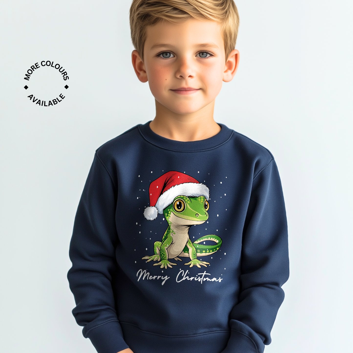Child wearing a navy blue sweatshirt with a Christmas-themed design of a green Gecko wearing a Santa hat.