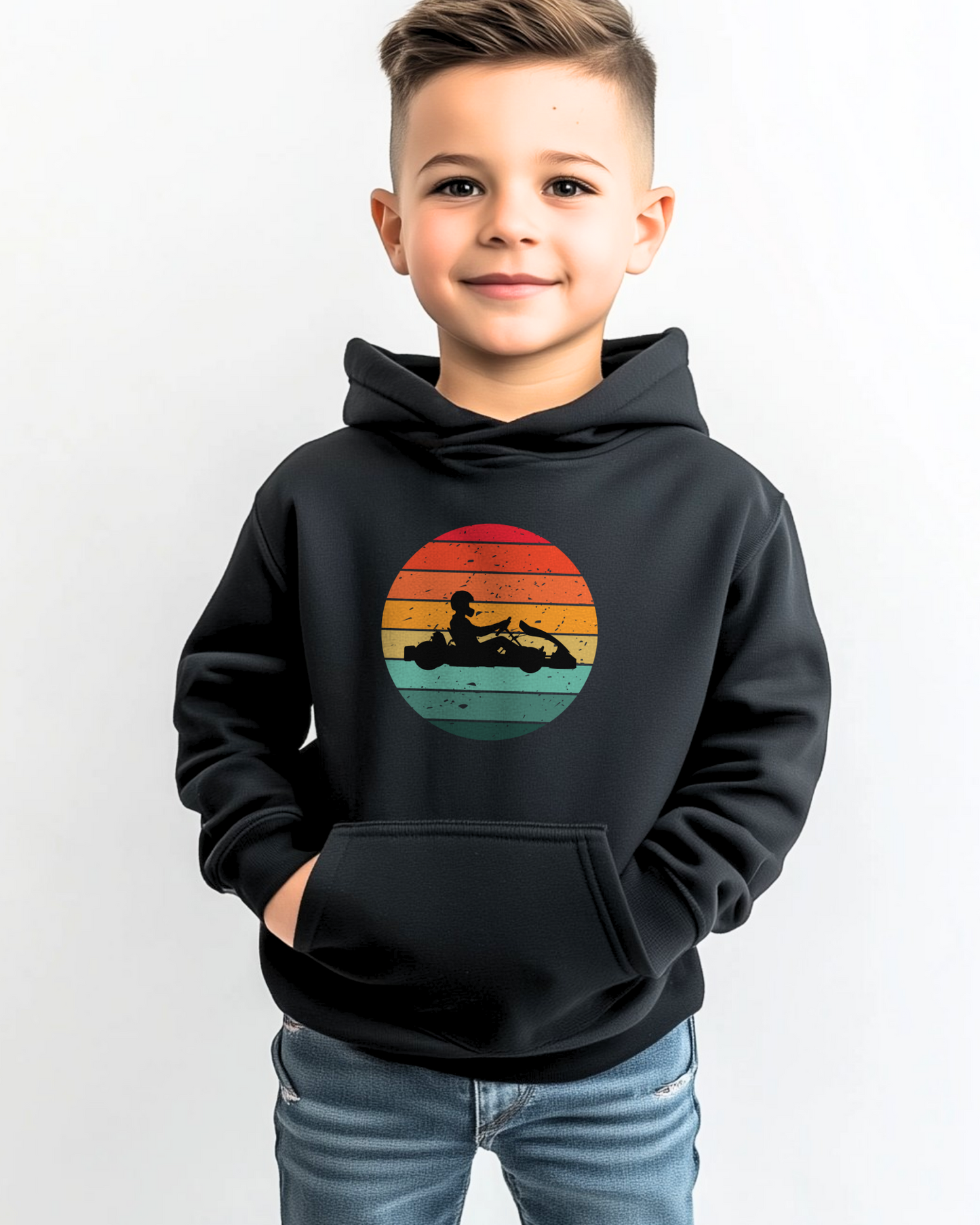 Young boy wearing black hoodie with retro sunset go-karting silhouette graphic
