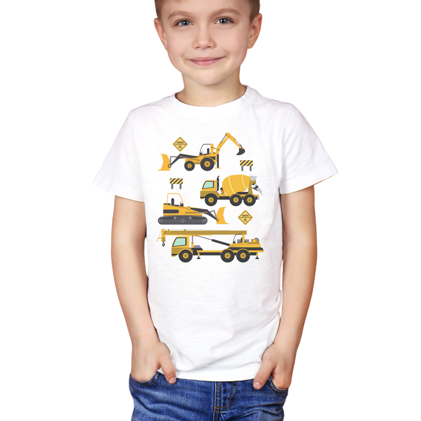 A young boy with short blonde hair and a slight smile models a white t-shirt. The shirt features a graphic with four cartoon-style yellow construction vehicles arranged vertically: an excavator, a cement mixer, a tracked crane, and a mobile crane.