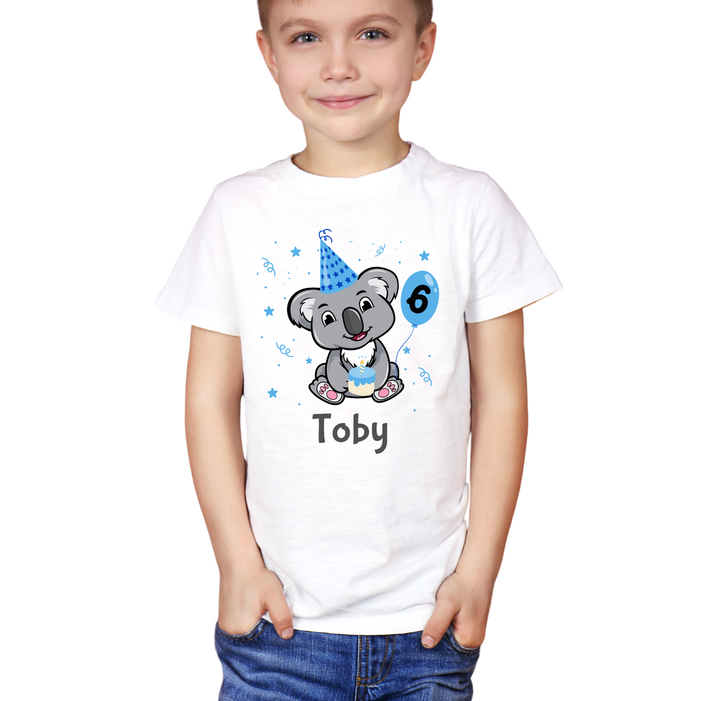 Young boy wearing a birthday T-shirt featuring a cute koala in a blue party hat holding a balloon with number six and cake, custom name printed underneath.