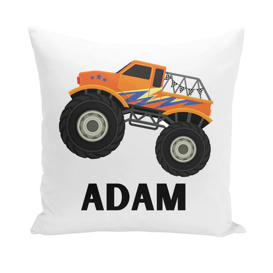 A white square cushion cover featuring a cartoon monster truck with large black wheels and an orange body with blue and yellow stripes. The name "ADAM" is printed below the truck.