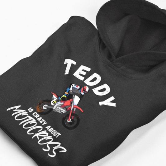 Black hoodie with 'Teddy is crazy about motocross' text and graphic on a white background