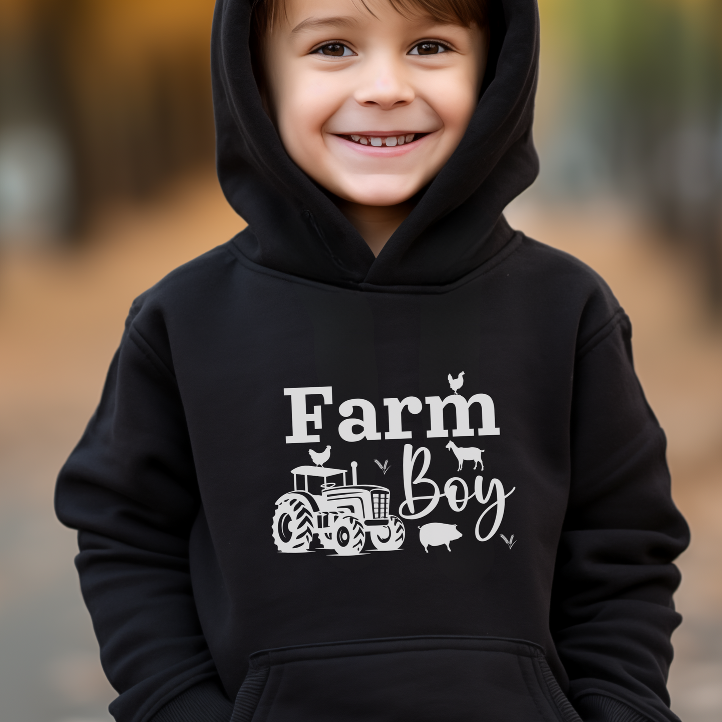 A child wearing a black pullover hoodie with 'Farm Boy' text and a graphic of a tractor on it.