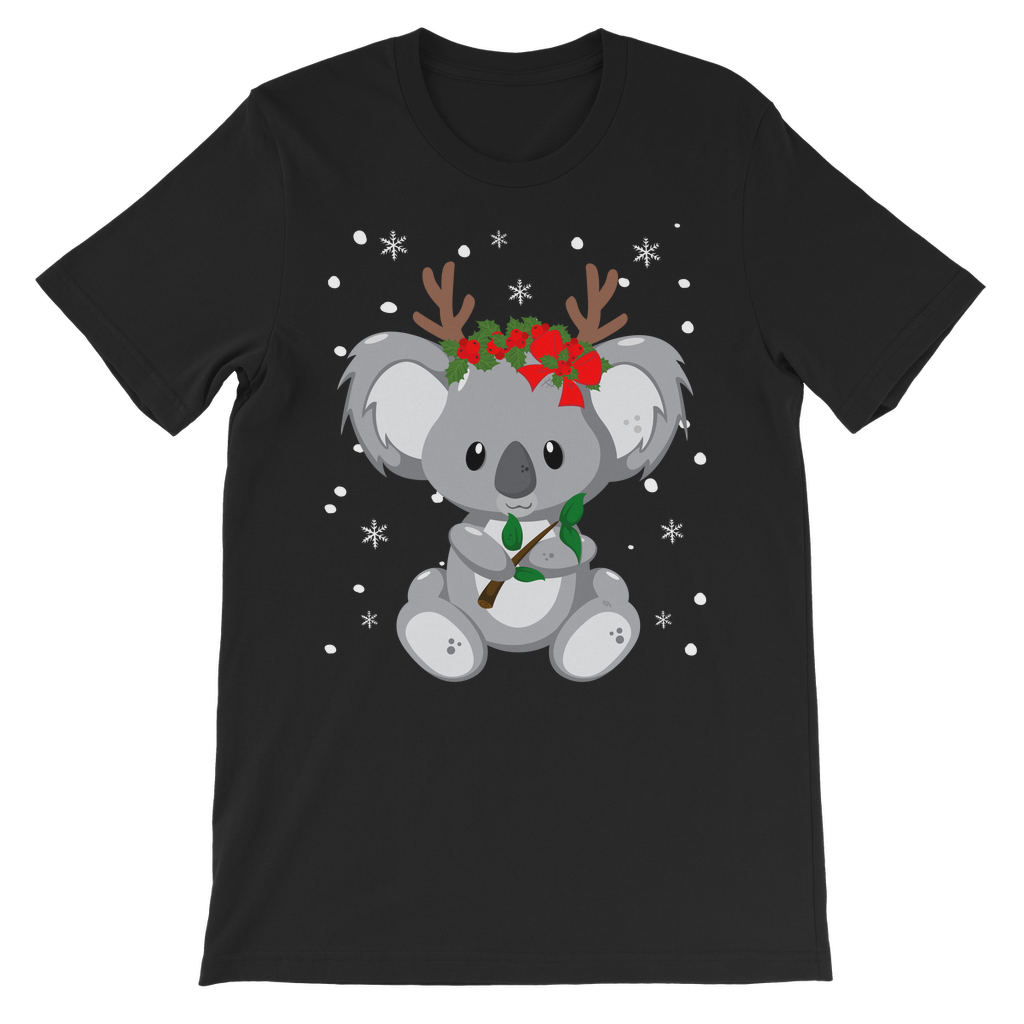 A kids black T-shirt with a printed koala wearing festive antlers and red bows, standing in front of a Christmas tree.