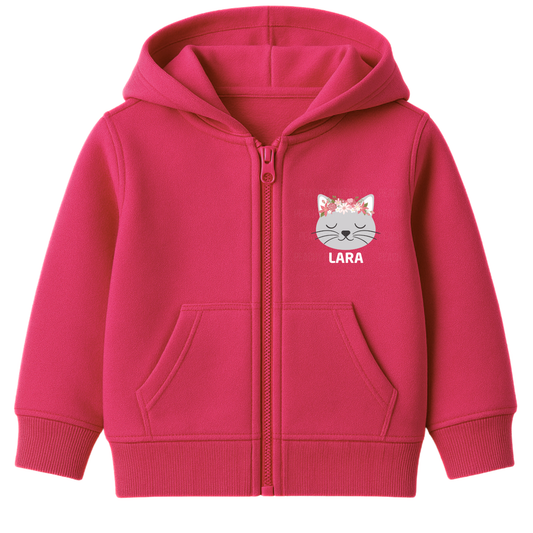 Girls pink personalised floral cat zip hoodie with custom name printed below a peaceful grey cat face wearing a pink and white flower crown