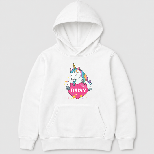 A girls-white pullover hoodie featuring a colourful cartoon unicorn graphic holding a pink heart with the name 'DAISY' printed on the front, set against a light grey background.