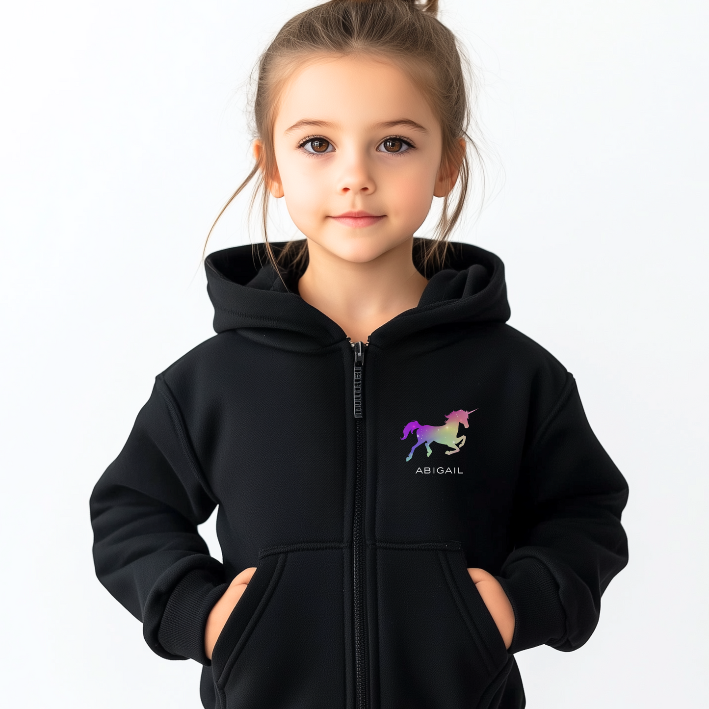 Child wearing a black hoodie with a unicorn logo and name on a white background
