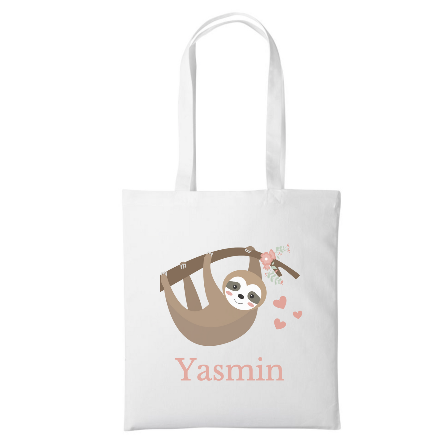A white tote bag with a cartoon sloth hanging from a branch surrounded by pink flowers and hearts. The name "Yasmin" is printed below the sloth.