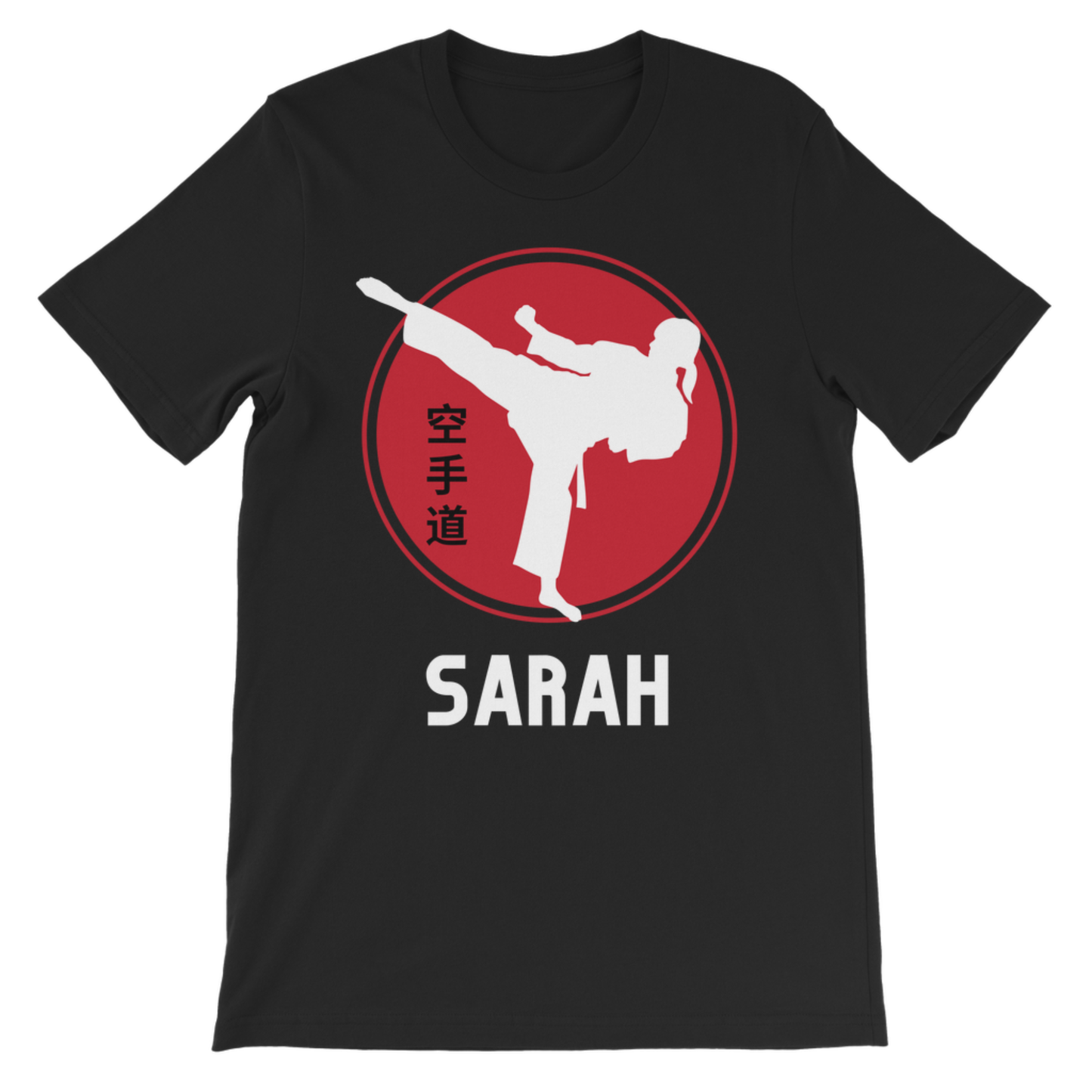 A kids black short-sleeve crewneck t-shirt featuring a red circular graphic with a white silhouette of a martial artist performing a kick and vertical Japanese characters. Below the graphic, the name 'SARAH' is printed in bold white capital letters.