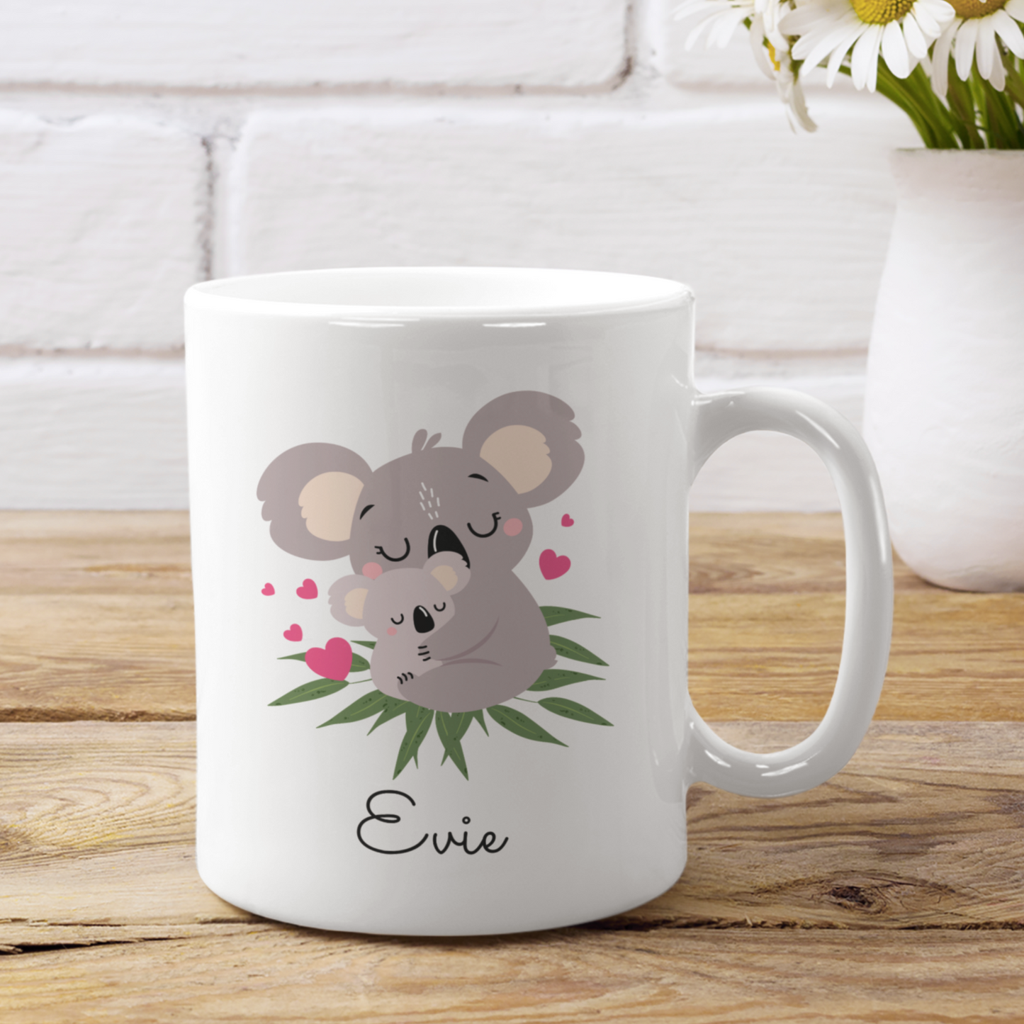 Girls personalised mug featuring a mother and baby koala design with a custom name printed underneath in black script.