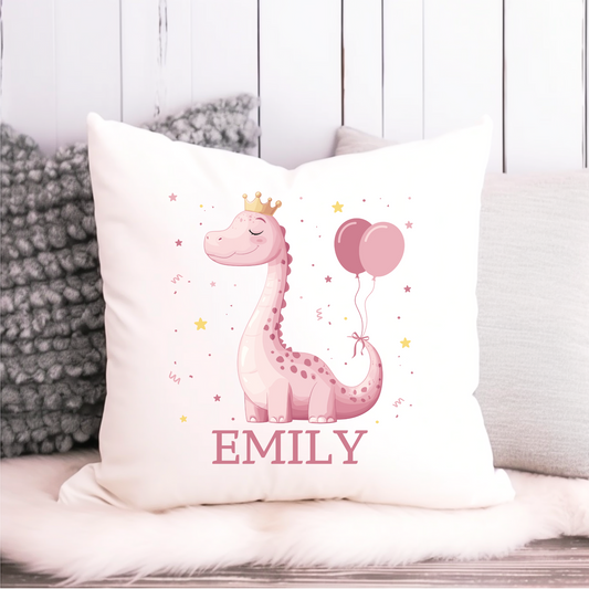 White cushion cover with a pink dinosaur wearing a crown, holding pink balloons, and personalised with the name "Emily" – perfect for girls’ birthday gifts or bedroom décor.
