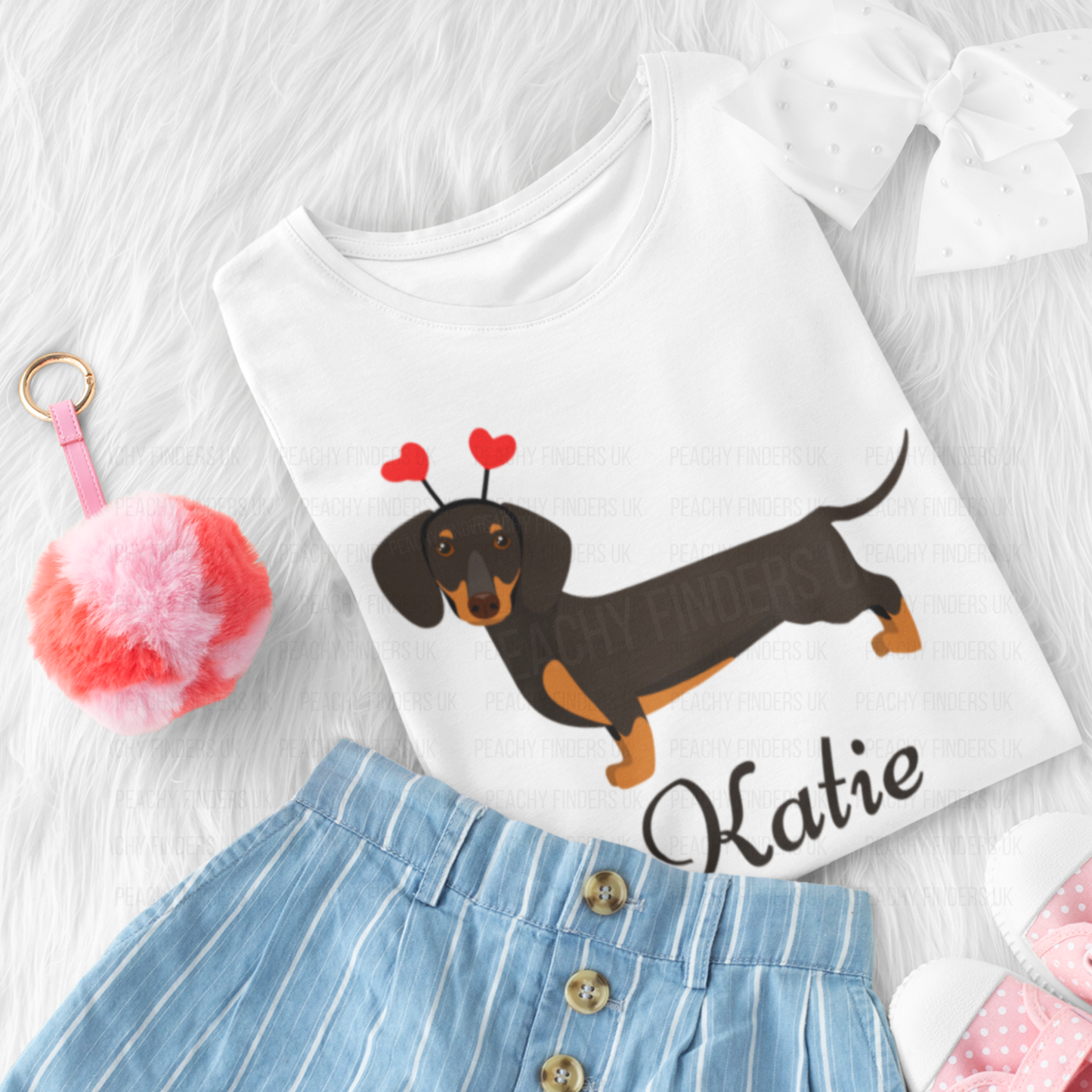 Personalised girls white t-shirt with sausage dog and red heart head-boppers, name "Katie" printed below, styled with skirt and bow.