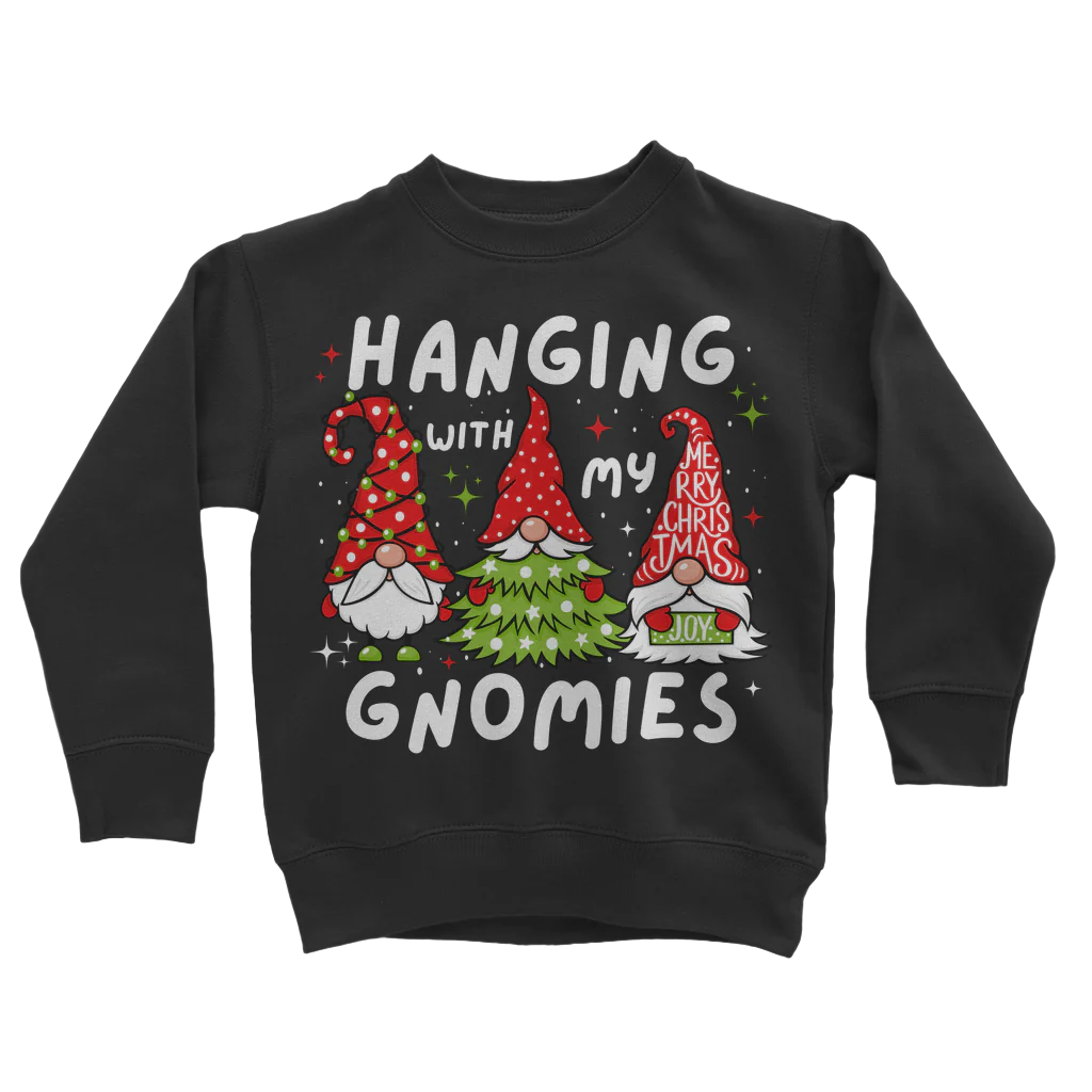 A kids black Christmas jumper with the text 'Hanging with my Gnomies' and graphic of gnomes on it.