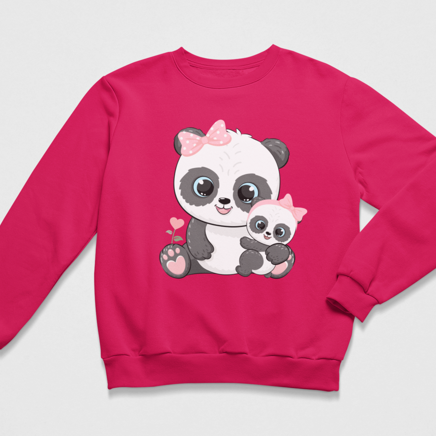 A bright pink crewneck sweatshirt featuring a cute cartoon graphic of a mother panda holding a baby panda, set against a light gray background.