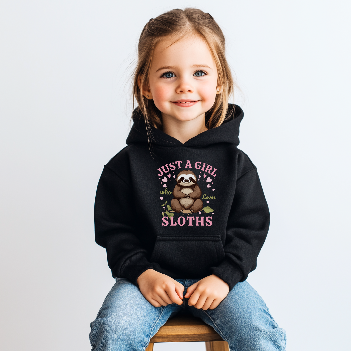 Child wearing a black hoodie with a sloth design and text on a white background