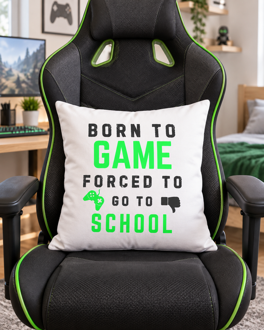 Born to Game Forced to Go to School cushion displayed on a black and green gaming chair in a child’s bedroom.
