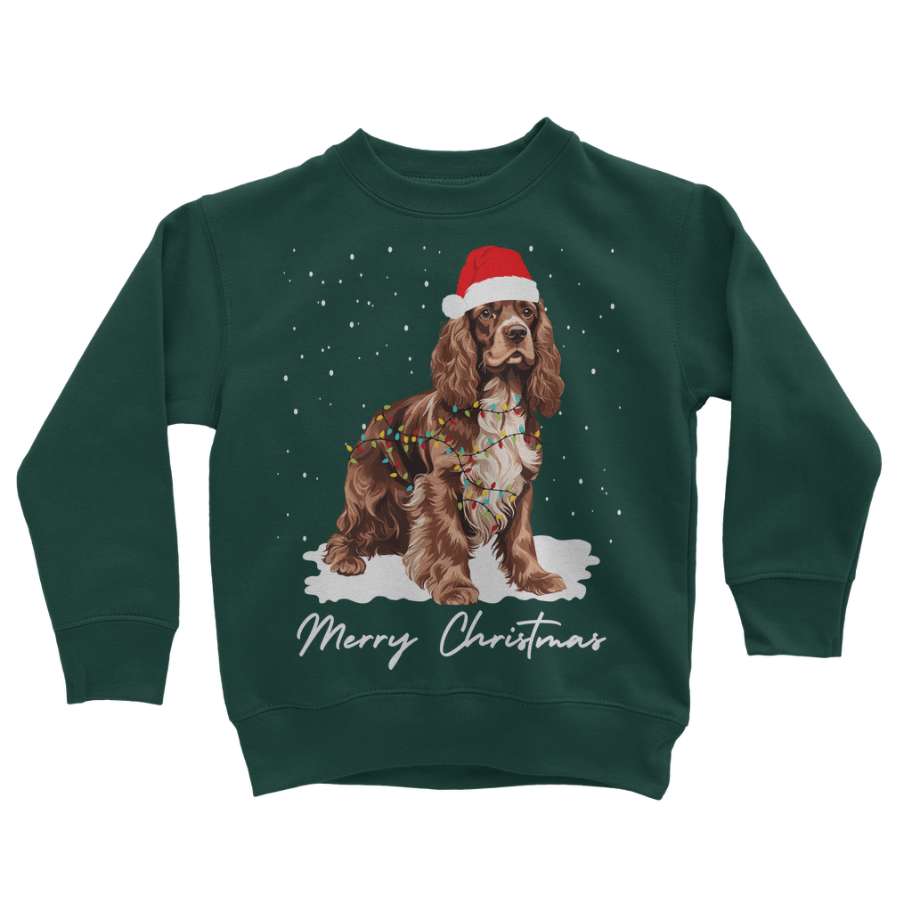 Children's dark green Christmas jumper with a design of a brown and white cocker spaniel wearing a Santa hat and the text 'Merry Christmas'.