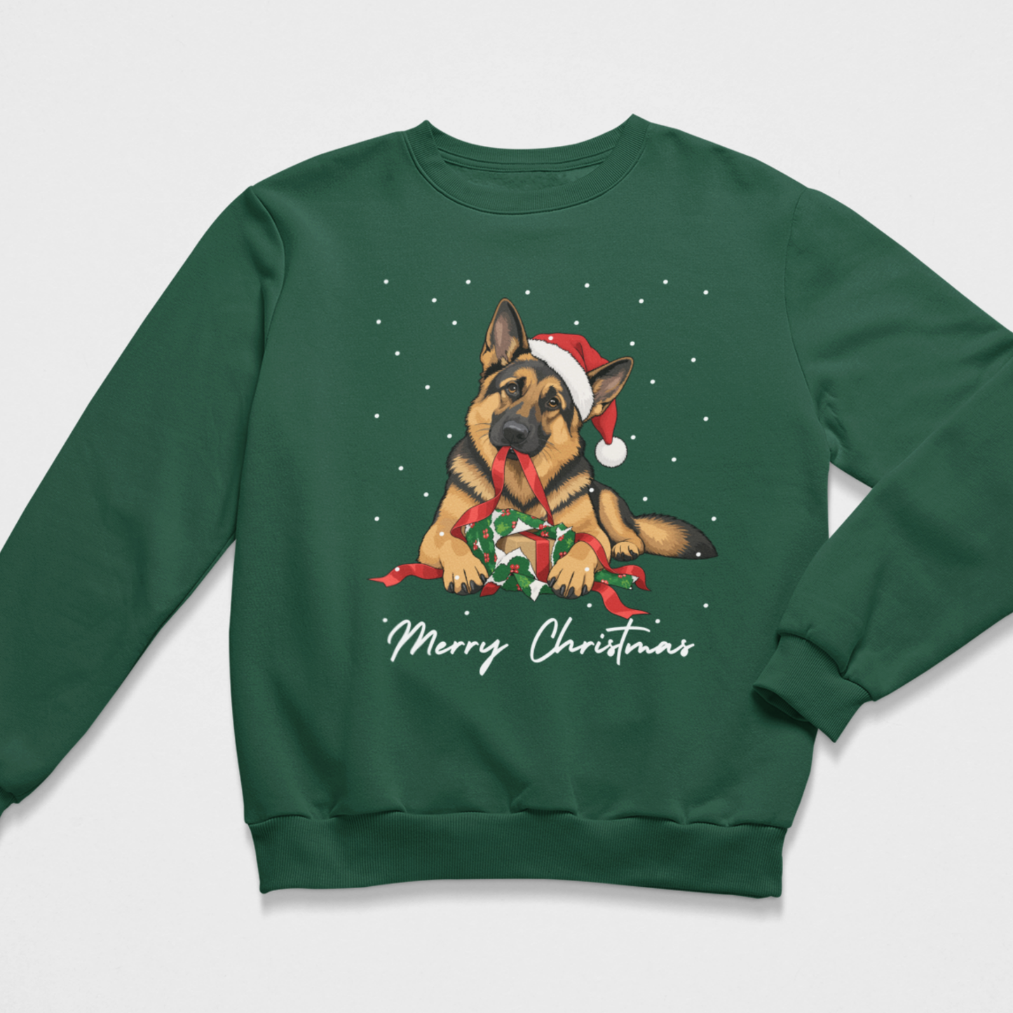 Flat lay of dark green kids Christmas sweatshirt featuring an illustration of a German Shepherd wearing a Santa hat and unwrapping a festive gift with 'Merry Christmas' text