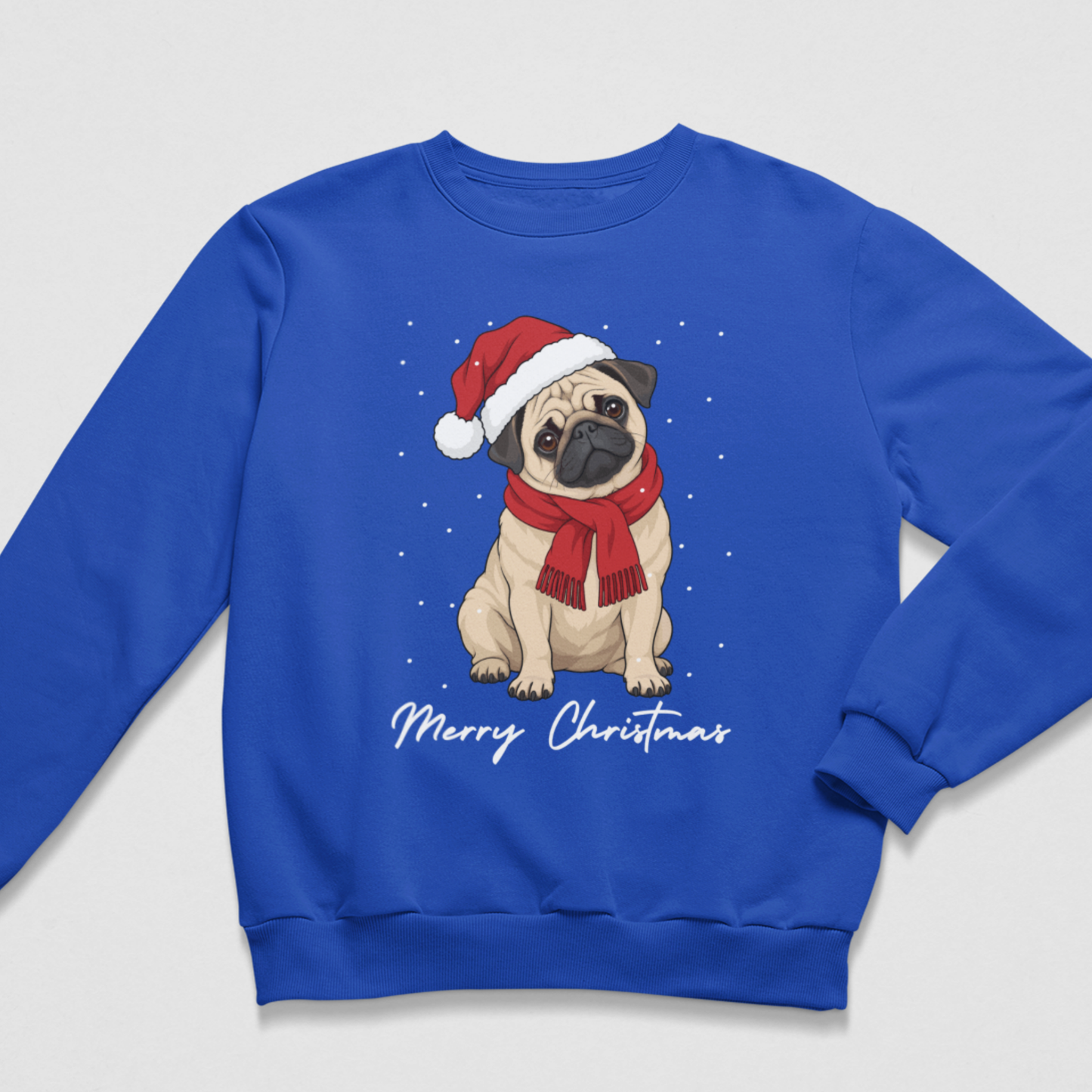 A kids royal blue crewneck sweatshirt featuring a graphic of a pug wearing a red Santa hat and scarf, surrounded by white snowflakes, with 'Merry Christmas' written in white script below.