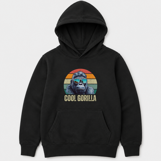 A kids black pullover hoodie with a front kangaroo pocket and a graphic of a gorilla wearing sunglasses inside a retro sunset circle, with the text 'COOL GORILLA' below, shown on a light grey background.