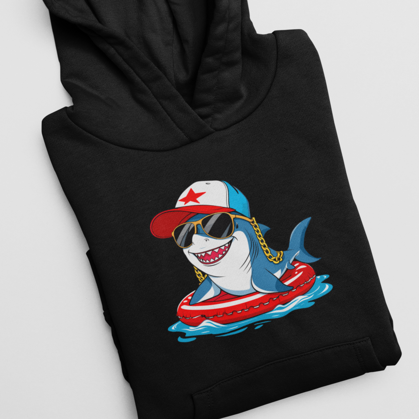 Black hoodie with a colorful shark graphic on a white background