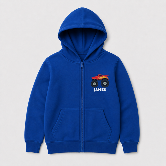 Royal blue kids full-zip hoodie featuring a red and yellow monster truck printed on the left chest with the name “James” below the design.