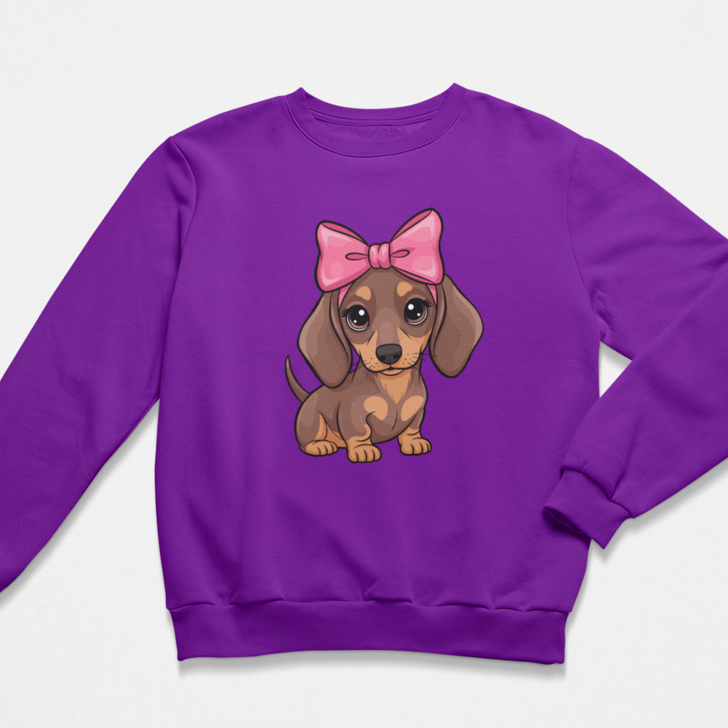 Girls purple sweatshirt featuring a cute dachshund puppy with a large pink bow, kids animal lover jumper.