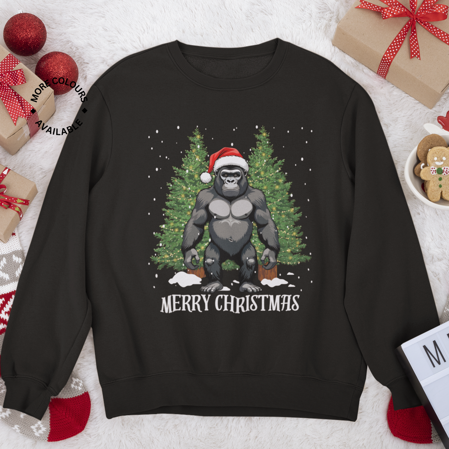 Black sweatshirt with a Christmas-themed design of a gorilla in a Santa hat, surrounded by trees and snowflakes, on a festive background with presents and cookies.