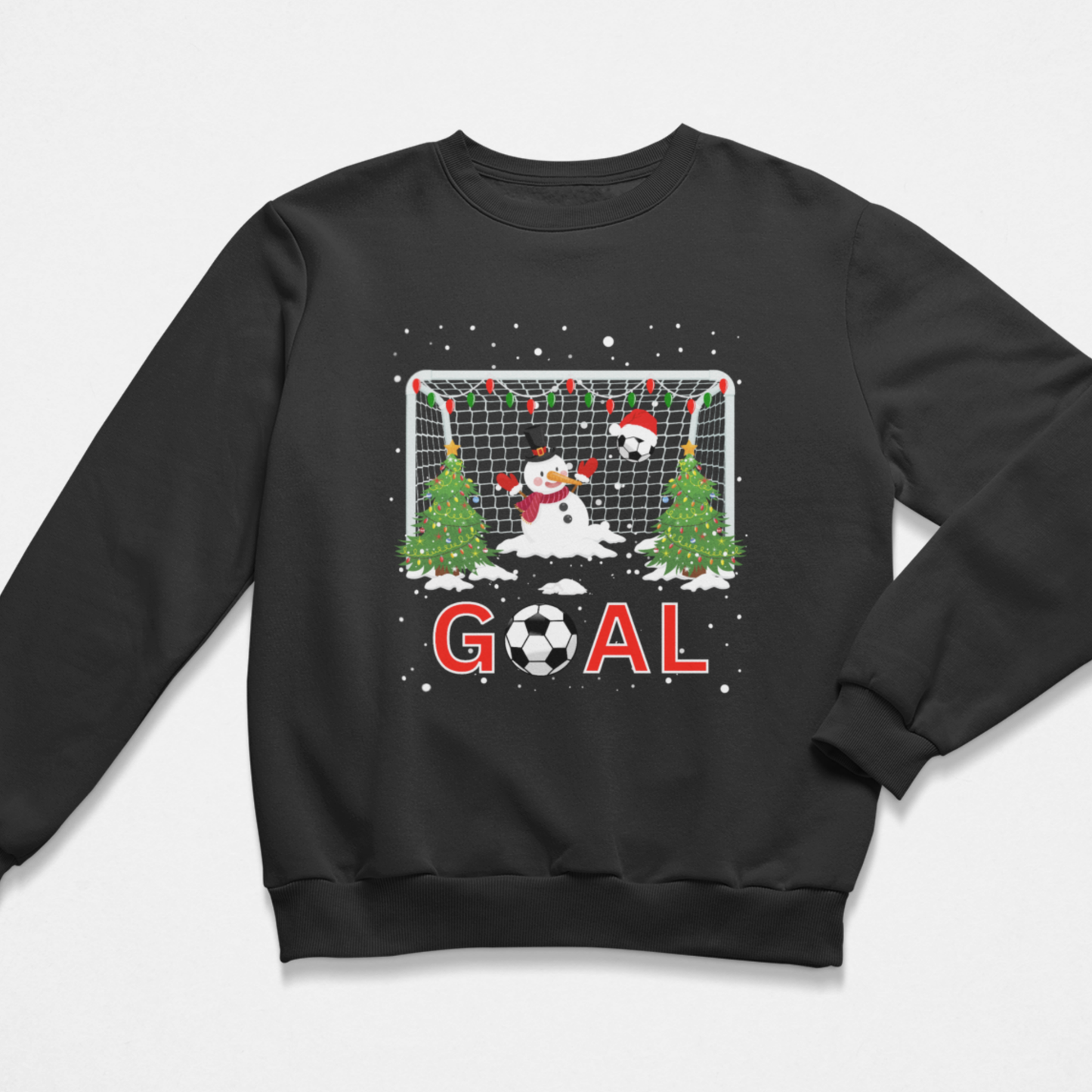 A boys black crewneck sweatshirt featuring a festive Christmas soccer graphic on the front. The design shows a snowman and a soccer ball in front of a soccer goal decorated with Christmas lights and trees, with the word 'GOAL' printed below in red and white.