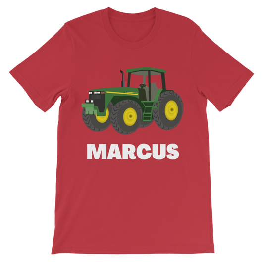 Red kids T-shirt with a green tractor and personalised name “Marcus” printed in bold white letters on the front.