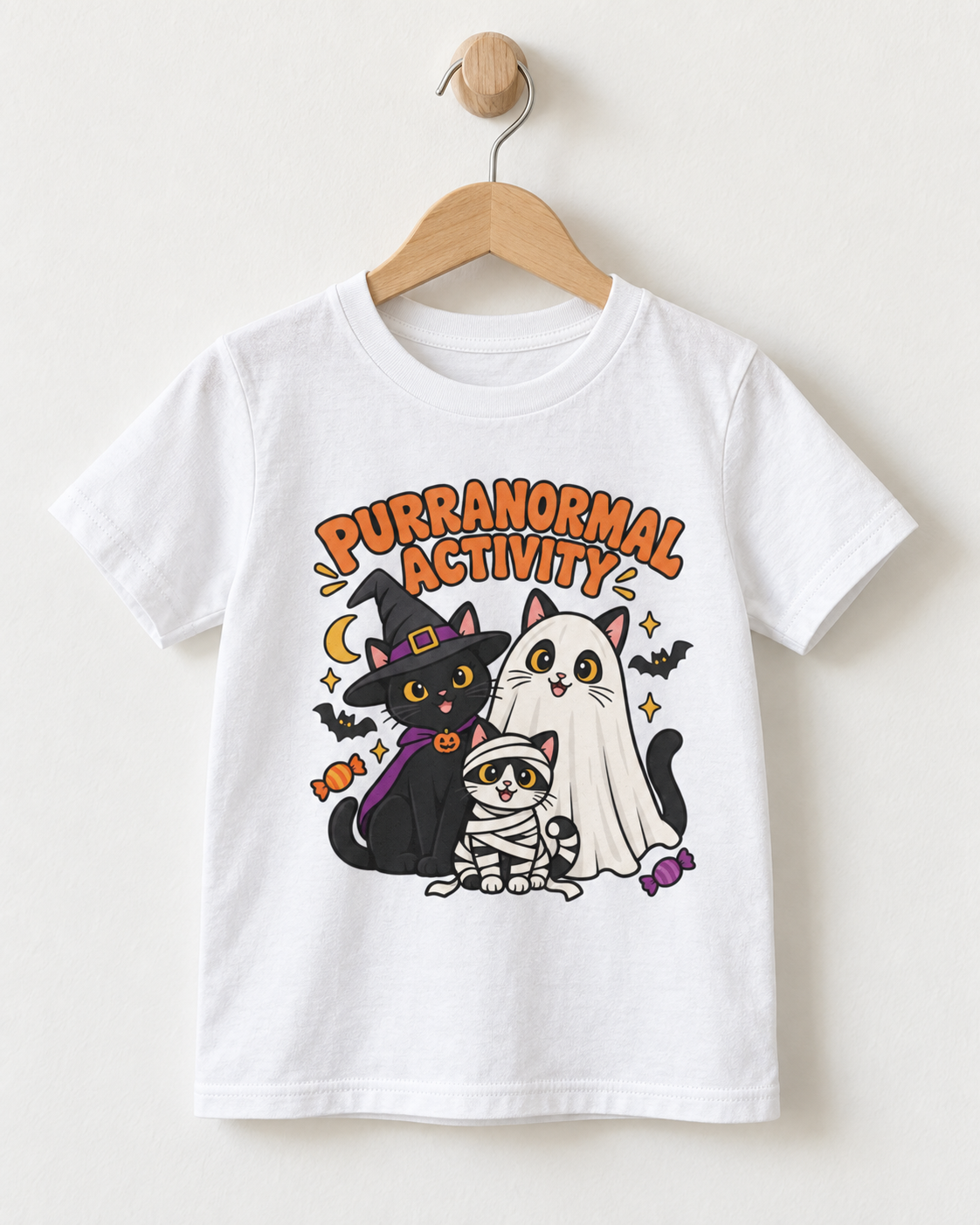 White kids’ Purranormal Activity Halloween cat T-shirt displayed on a natural wooden hanger