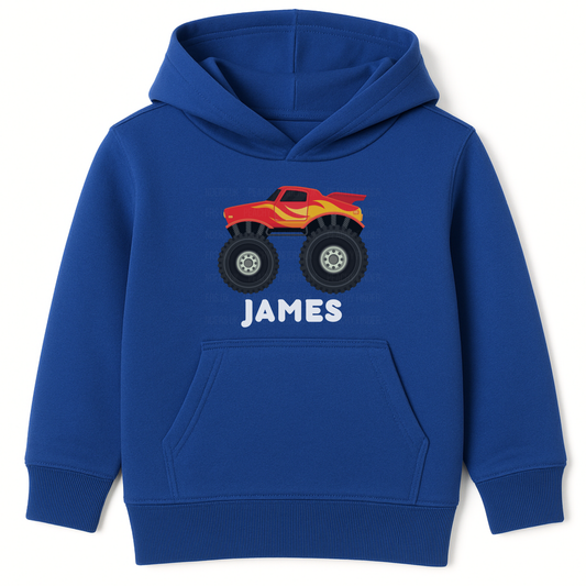 Personalised kids royal blue monster truck hoodie with red truck graphic and custom name James printed on the front.