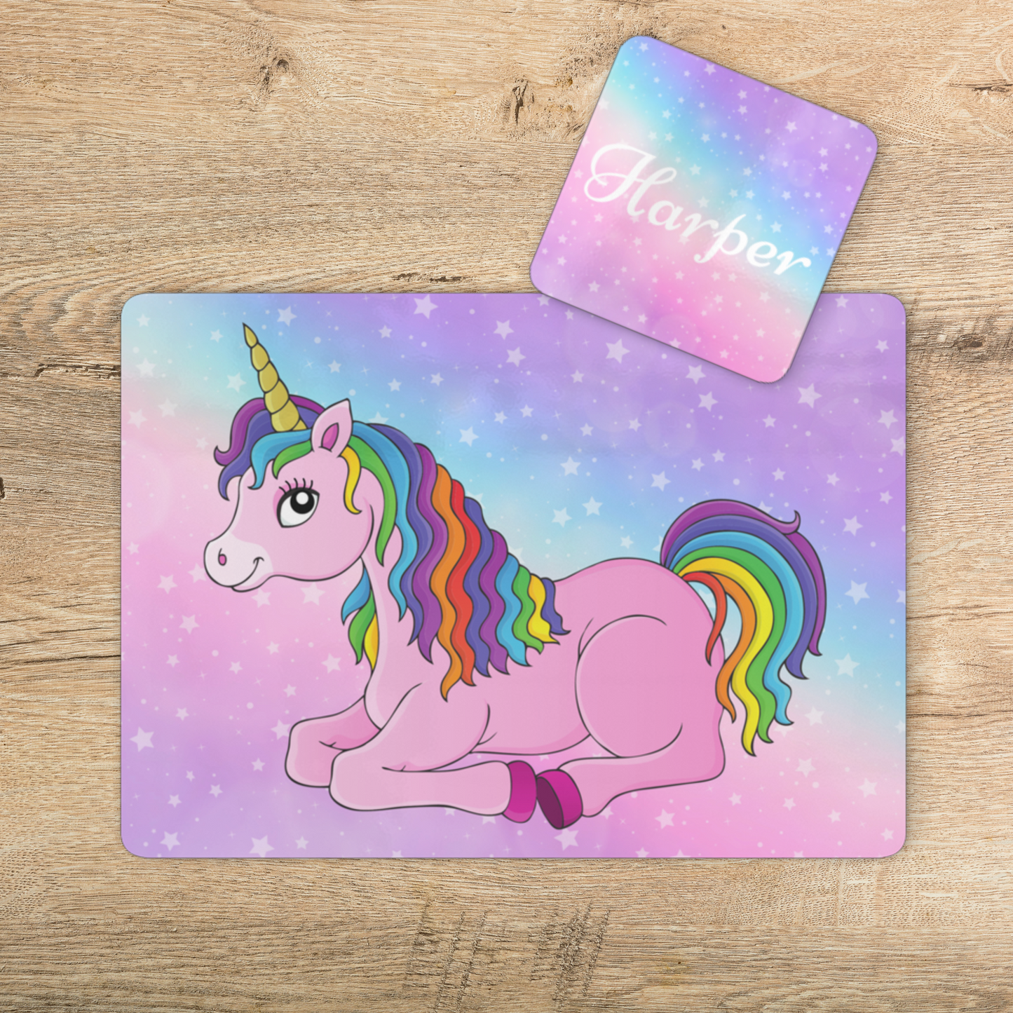 girls unicorn placemat and coaster styled on a wooden table