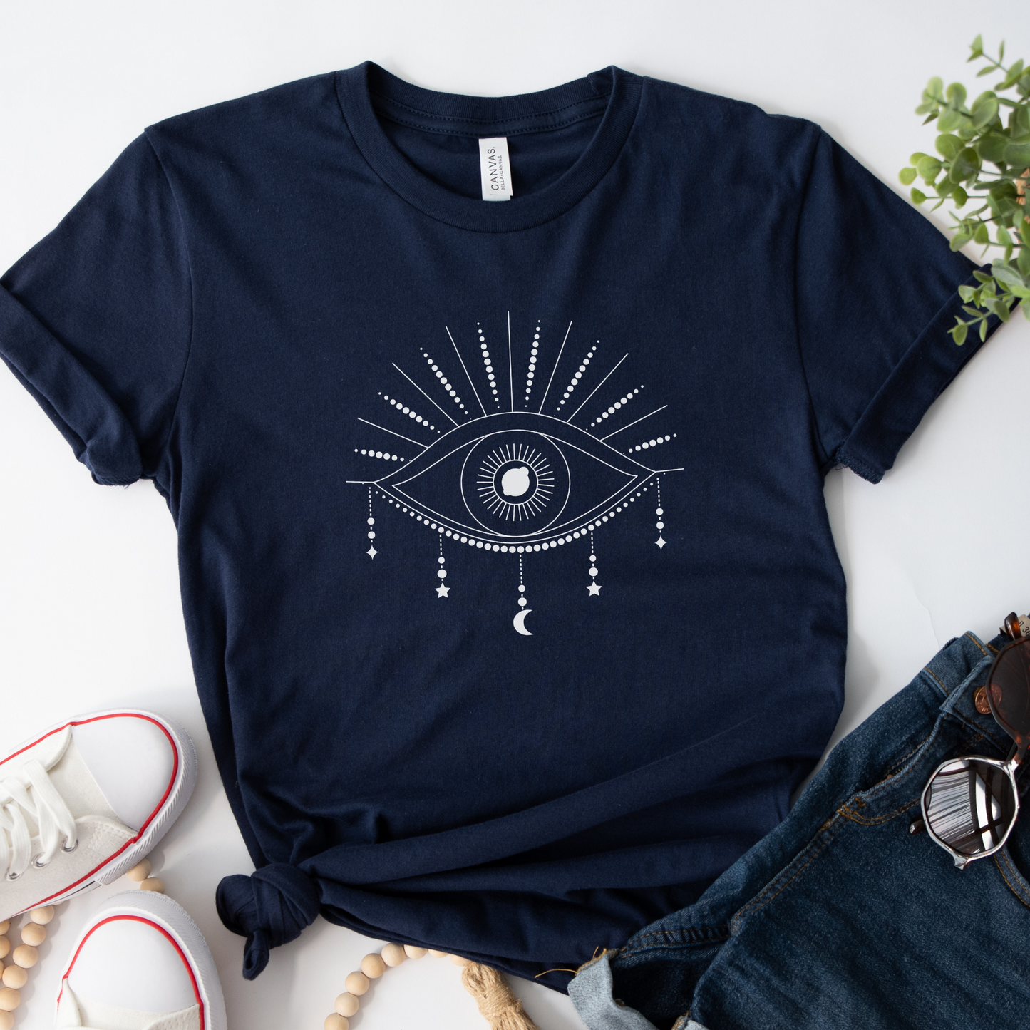 Navy cotton t-shirt with a mystical eye graphic design in the centre.