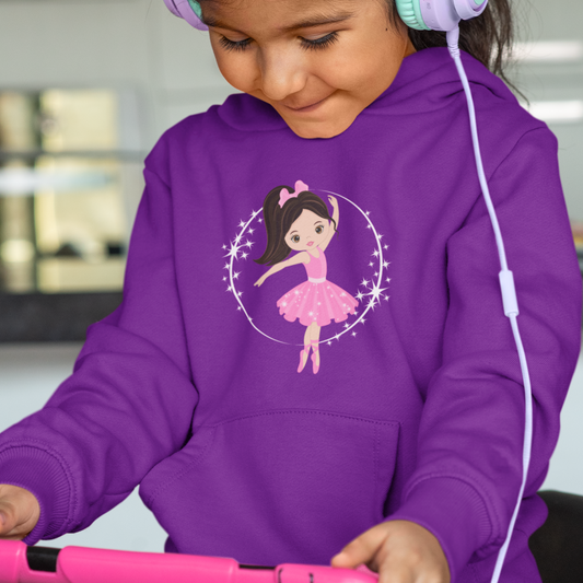 Happy little girl wearing a purple hoodie with a ballerina and stars design