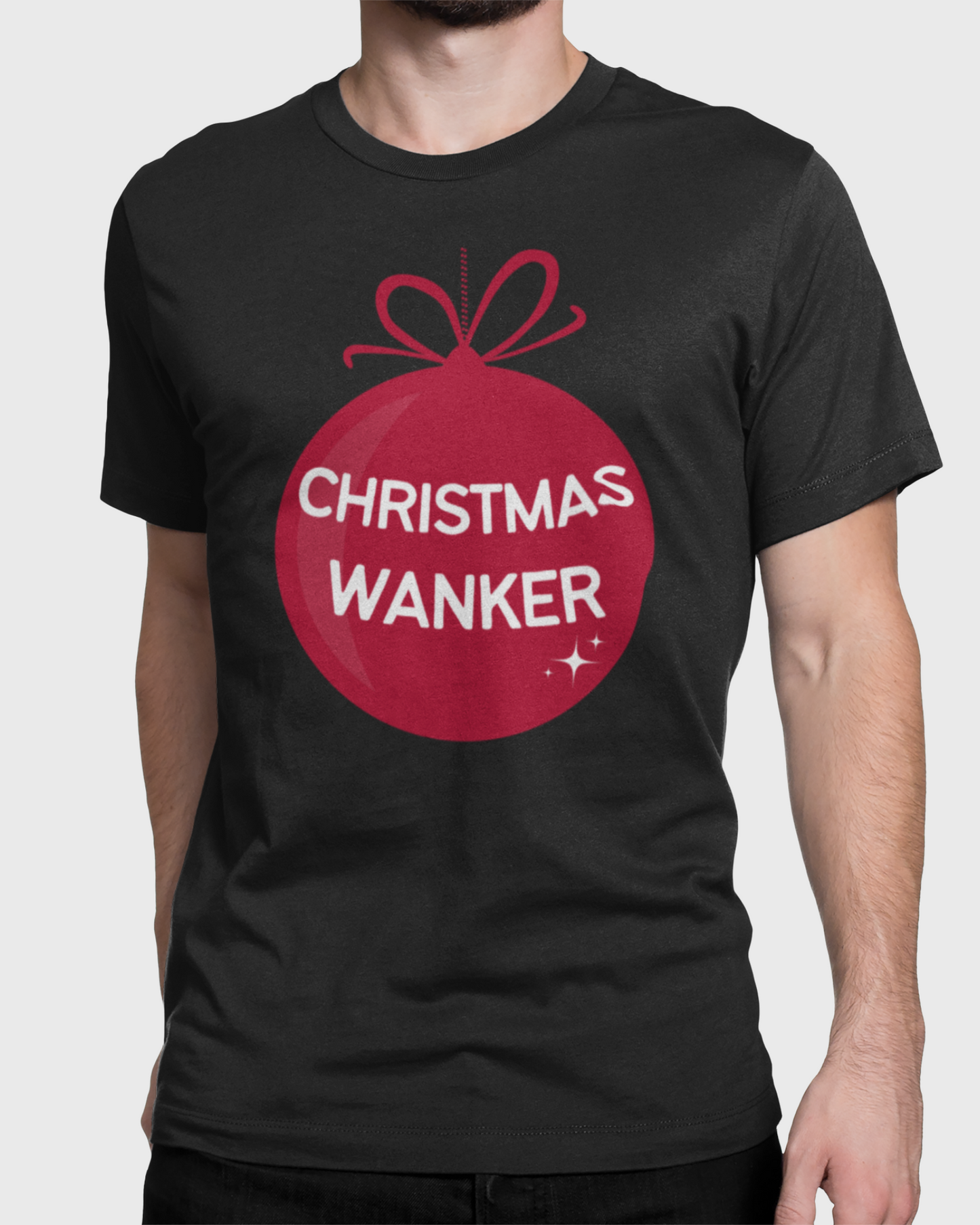 A man wearing a black t-shirt with a red Christmas ornament graphic that reads 'CHRISTMAS WANKER' in white text, shown against a light gray background.