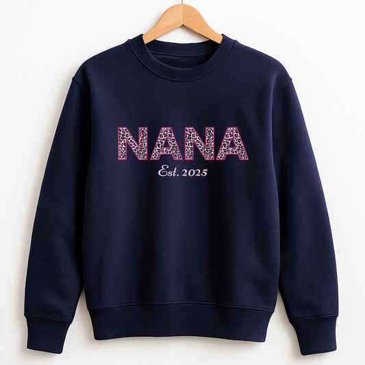 Navy personalised “NANA Est. 2025” leopard print sweatshirt on wooden hanger