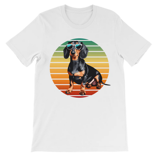 A white t-shirt features a circular graphic of a black and tan Dachshund dog wearing mirrored sunglasses, set against horizontal stripes of orange, yellow, and green.