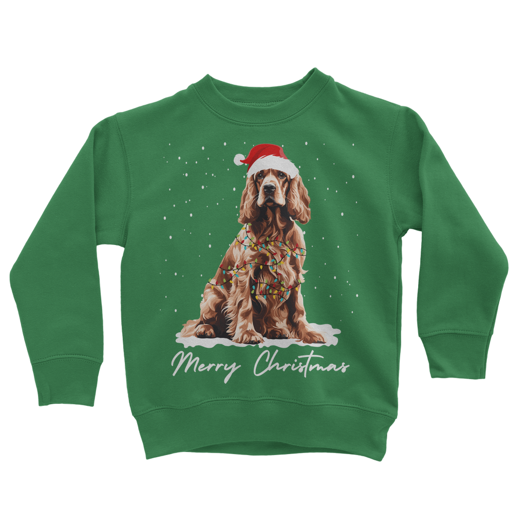 A kids green festive sweatshirt with a graphic of a cocker spaniel wearing a Santa hat and the text 'Merry Christmas'.