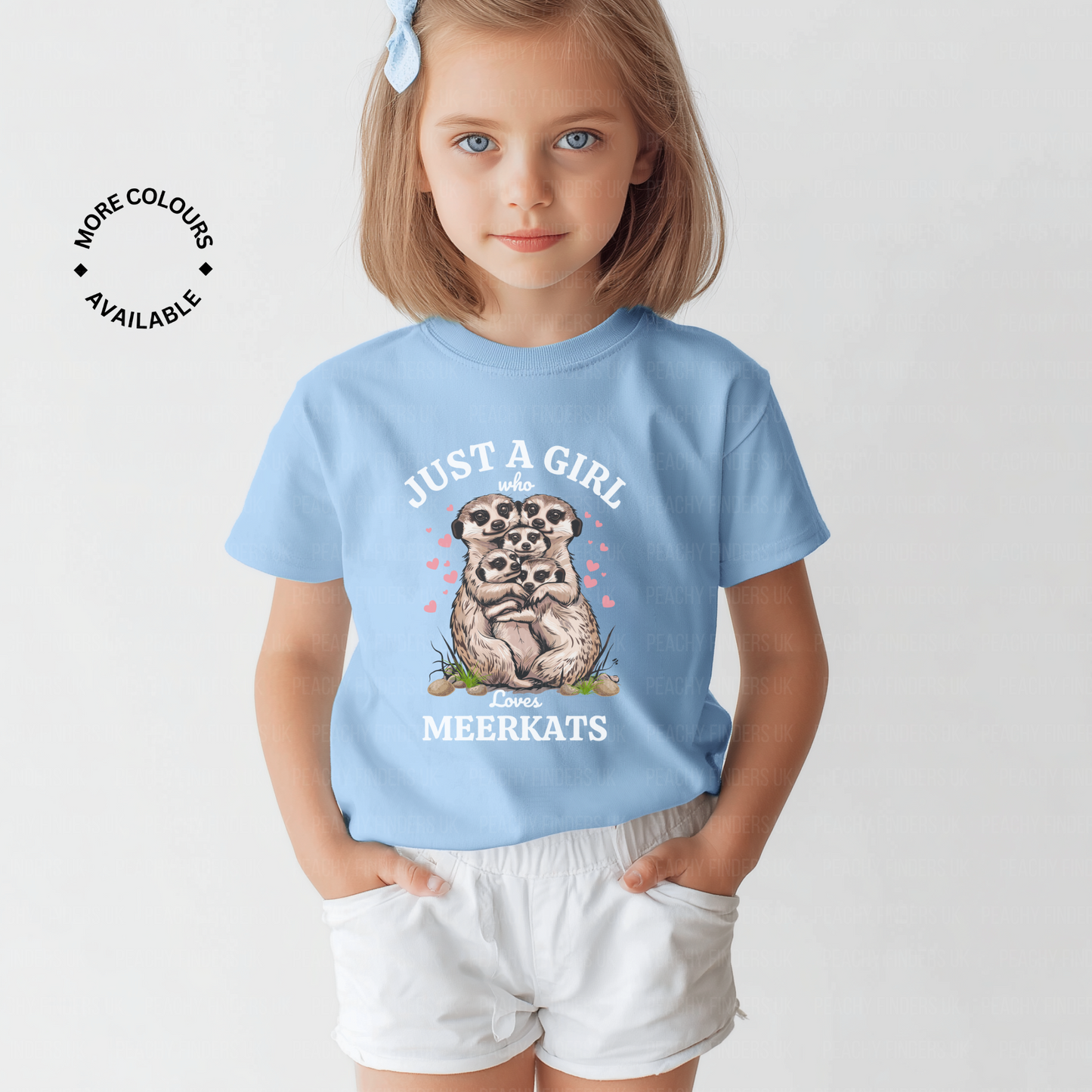 Child wearing a light blue t-shirt with a meerkat graphic and text on a plain background