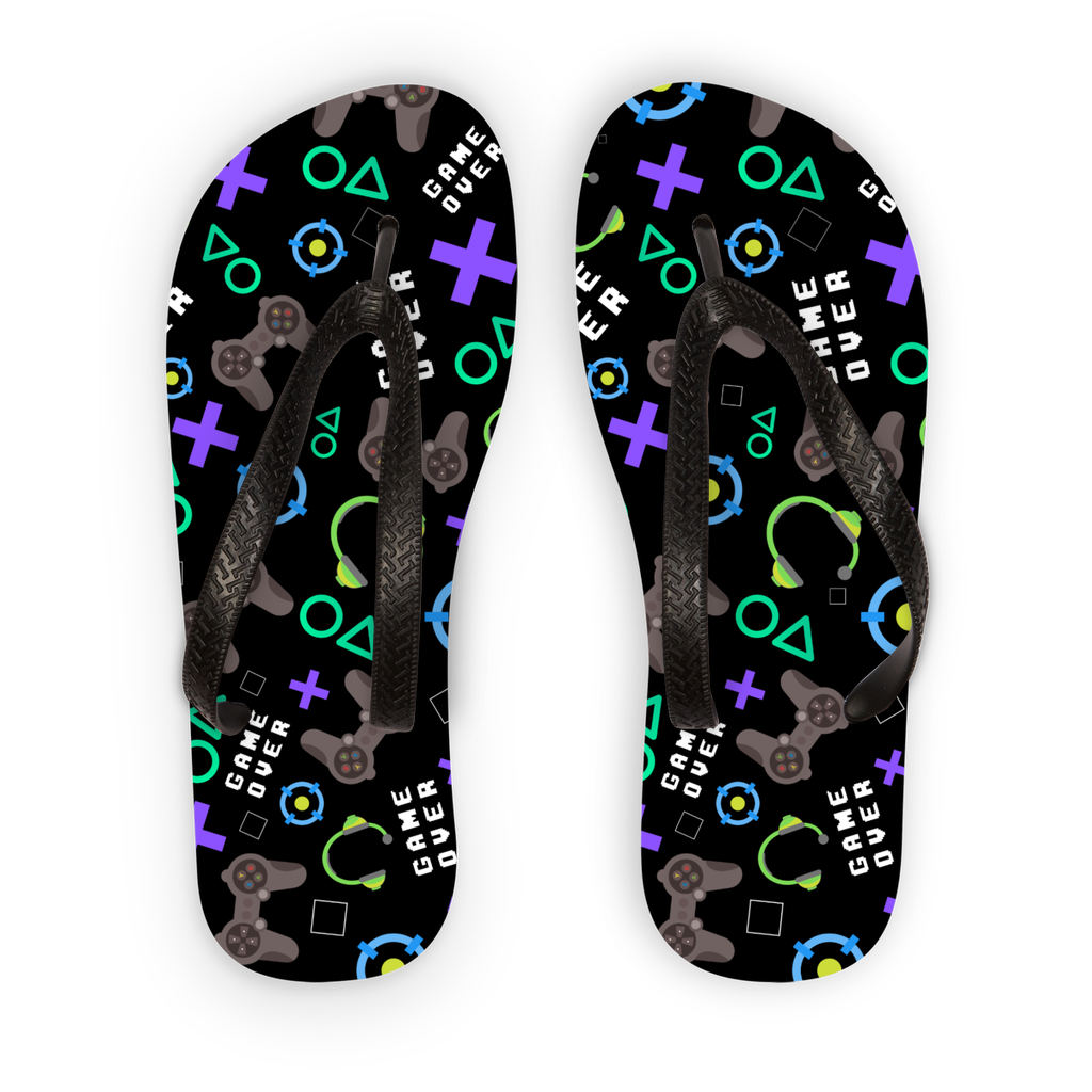 A pair of black kids flip-flops with a gaming pattern consisting of game icons and text on the straps