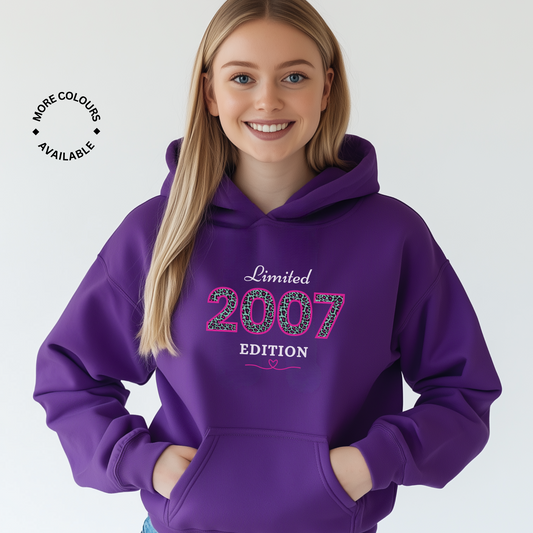 Woman wearing a purple hoodie with 'Limited 2007 Edition' text on a white background
