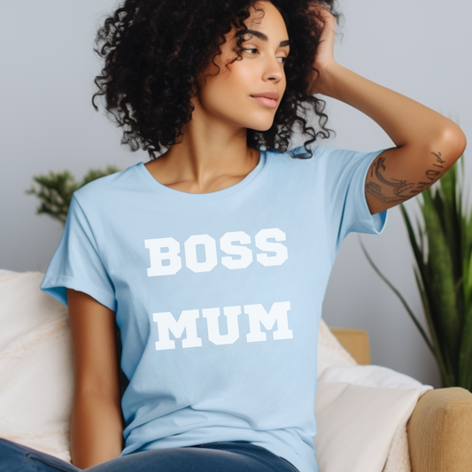 A woman wearing a light blue short sleeve t-shirt with the words "boss mum"