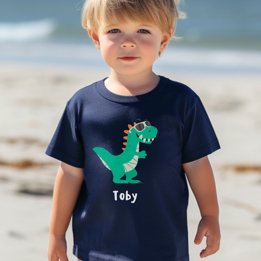 A boys personalised dark blue t-shirt with printed t-rex wearing sunglasses