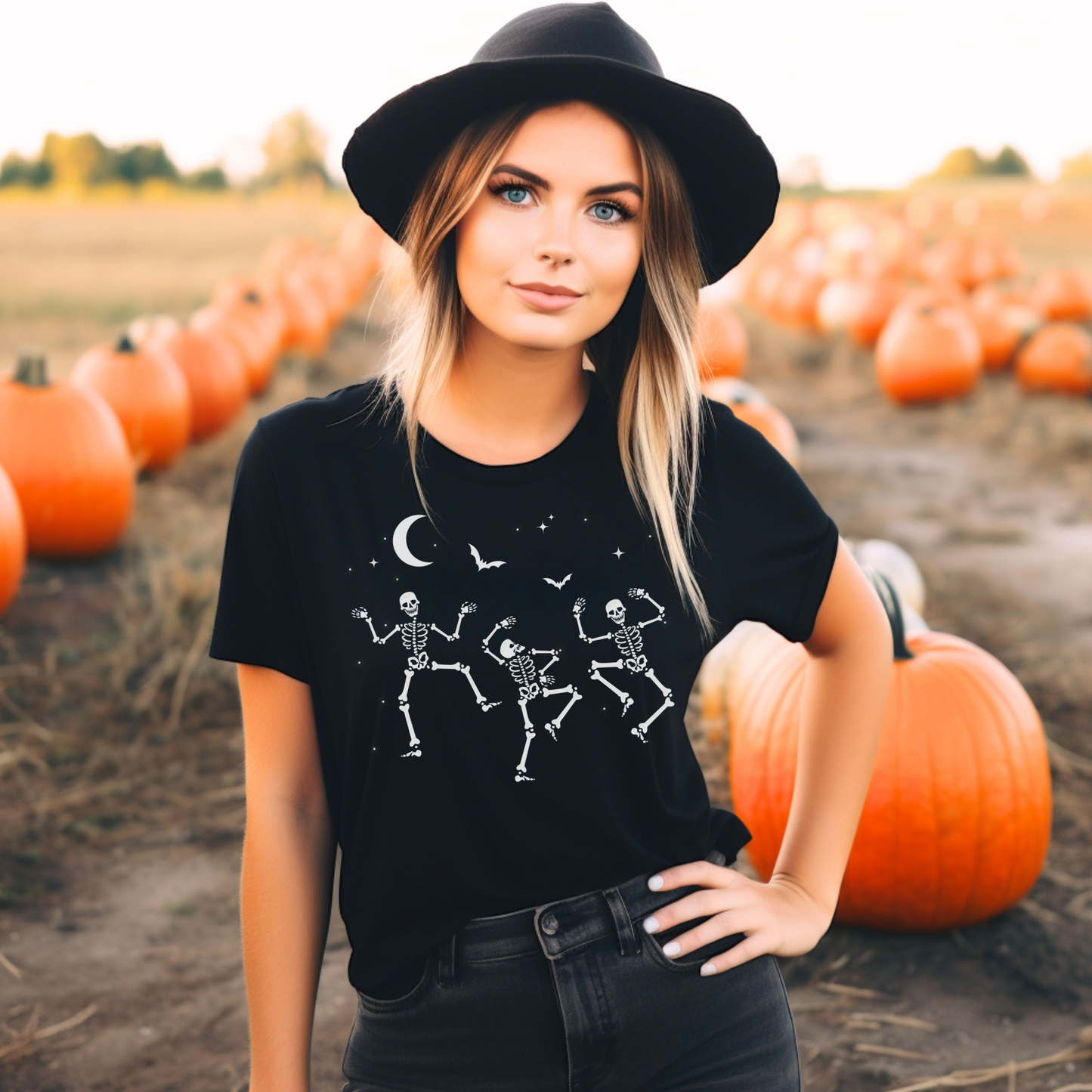 Woman wearing a black t-shirt with dancing skeletons