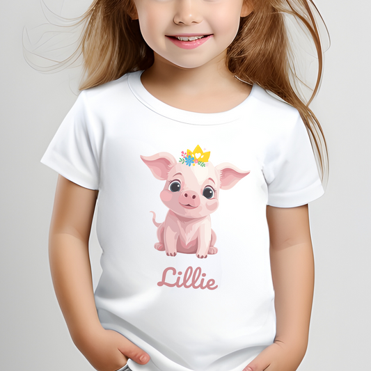 Girl wears a pink princess pig, pig is wearing a floral tiara with hearts, personalised t-shirt with name