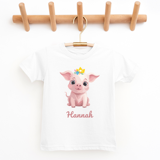 Girls white t-shirt with a printed pig, pig wears a princess crown, child's custom name printed below